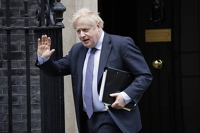 British Prime Minister Boris Johnson leaves 10 Downing Street in London on February 12. Photo: AP