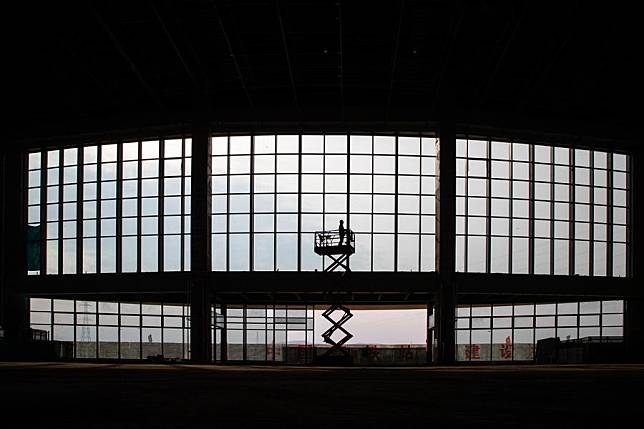 A staff member of China Railway Construction Group Co., Ltd. checks the curtain wall at the construction site of Yichun West Railway Station in Yichun, northeast China's Heilongjiang Province, Oct. 25, 2024. (Xinhua/Zhang Tao)