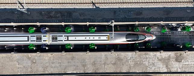 An automatic car washing system operates at a high-speed train depot in Shenzhen, south China's Guangdong Province, Jan. 17, 2025. (Xinhua/Mao Siqian)