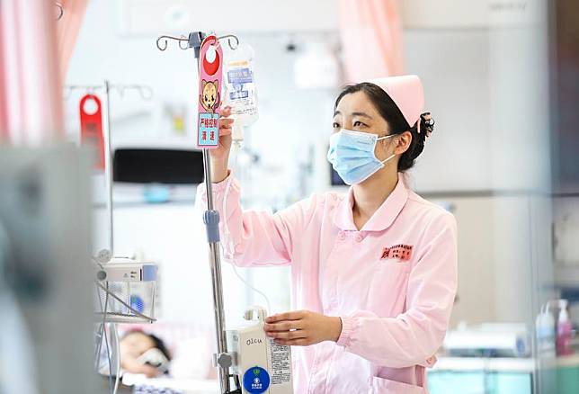 A nurse works at a maternal and child health care hospital in Huai'an City, east China's Jiangsu Province, May 12, 2024. (Photo by Zhao Qirui/Xinhua)