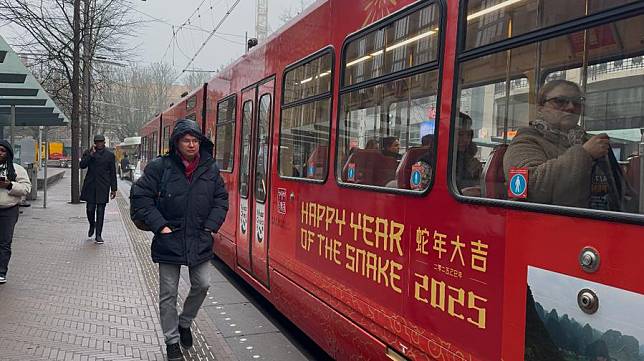 A tram decorated to celebrate the 2025 Chinese New Year is pictured in the center of The Hague, the Netherlands, on Jan. 21, 2025. (Photo by Sun Jingjing/Xinhua)