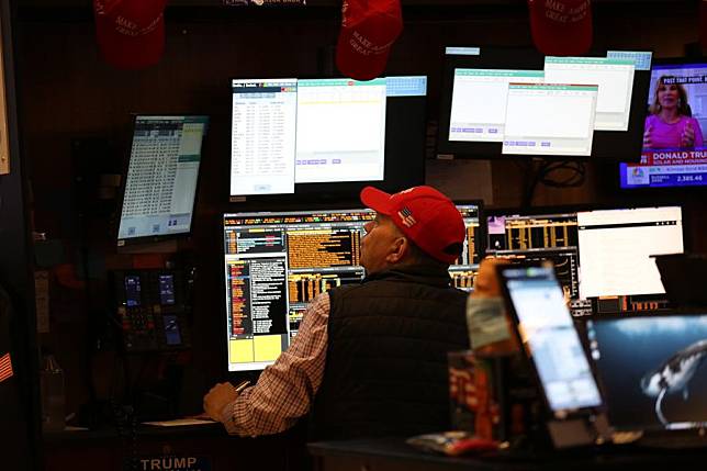 A trader works on the trading floor of the New York Stock Exchange in New York, the United States, on Nov. 6, 2024. (Xinhua/Liu Yanan)