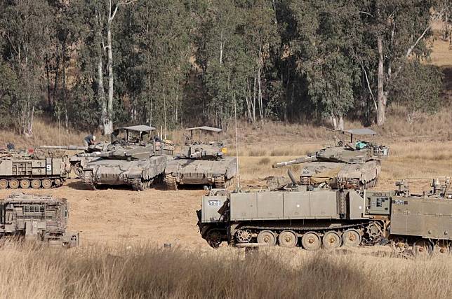 Israeli armored vehicles are deployed near Kibbutz Reim in southern Israel, on May 9, 2024. (Photo by Gil Cohen Magen/Xinhua)
