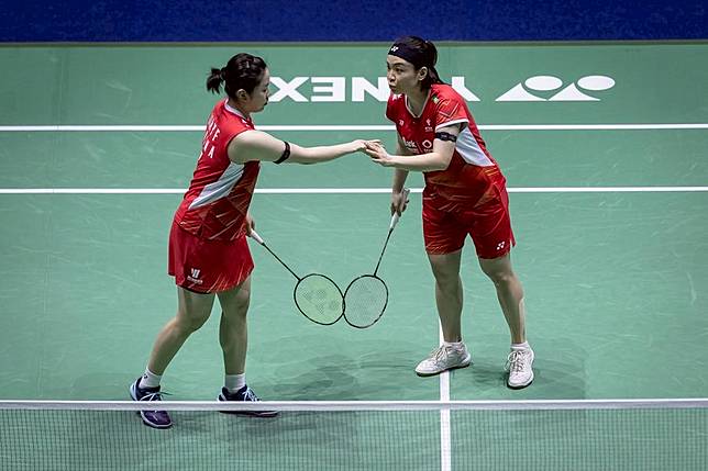 Chen Qingchen ® /Jia Yifan of China talk during the women's doubles semifinal match against Mayu Matsumoto/Wakana Nagahara of Japan at the French Open Badminton tournament in Paris, France, March 9, 2024. (Photo by Aurelien Morissard/Xinhua)