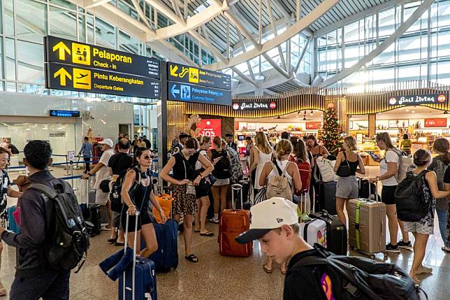 Passengers are pictured at I Gusti Ngurah Rai International Airport in Bali, Indonesia, Nov. 14, 2024. (Photo by Dicky Bisinglasi/Xinhua)