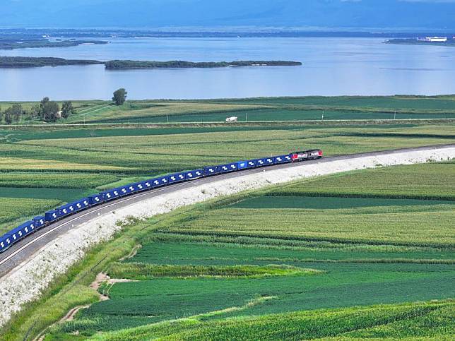 An aerial drone photo shows a train for China-Europe freight service pulling out of Tongjiang North Railway Port in northeast China's Heilongjiang Province, Aug. 9, 2024. (Photo by Wu Yunan/Xinhua)