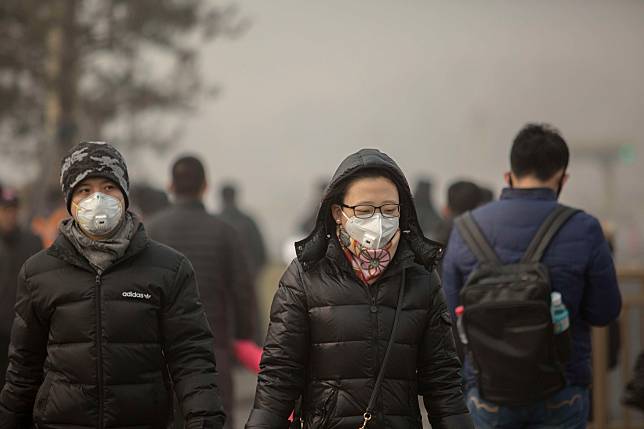 People walk on the street, wearing special mask to prevent