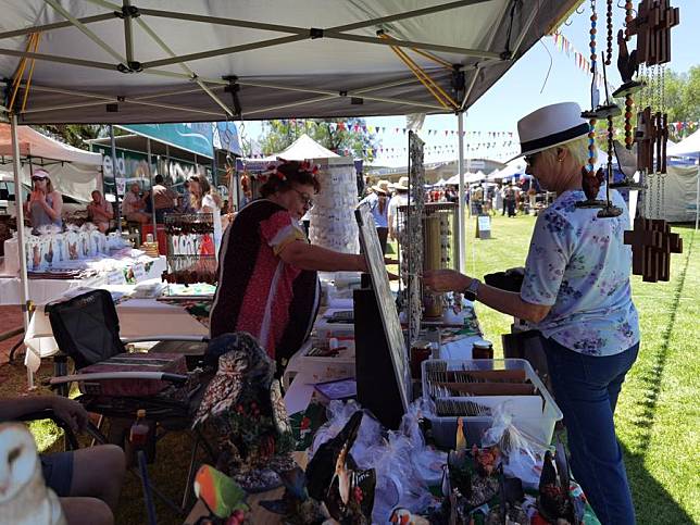 Vendors and visitors are seen at Die Windhoek se Eie Boeremark in Windhoek, the capital of Namibia, on Dec. 7, 2024. (Photo by Ndalimpinga Iita/Xinhua)