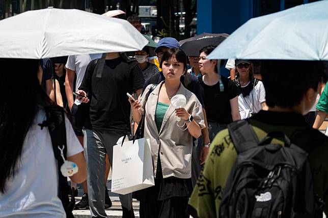 People walk on a street in Tokyo, Japan, July 4, 2024. (Xinhua/Zhang Xiaoyu)