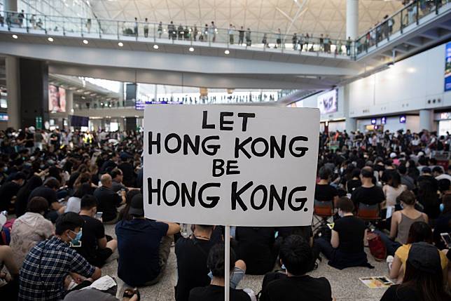 A poster spells out the mood as protesters rally in the arrivals hall of Hong Kong International Airport on August 9. The demonstrations were part of a three-day sit-in to call for the withdrawal of a suspended extradition bill and the introduction of universal suffrage, as well as to raise awareness among international visitors about alleged police brutality against protesters. Photo: EPA-EFE