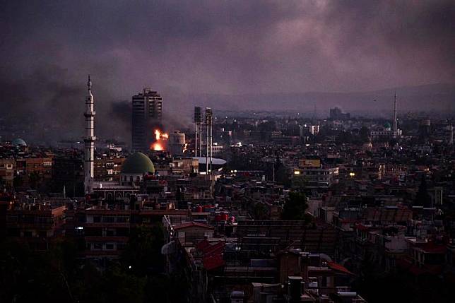 This photo taken on Dec. 8, 2024 shows thick smoke after an explosion in Damascus, Syria. (Photo by Monsef Memari/Xinhua)