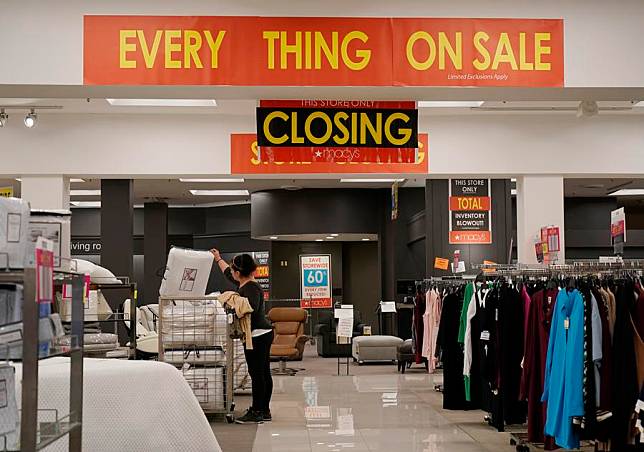 A customer shops at a Macy's store which will be closed soon in San Leandro, the United States, Feb. 27, 2024. (Photo by Li Jianguo/Xinhua)