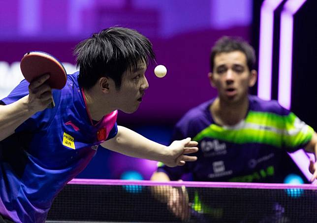 Fan Zhendong (L) serves against Hugo Calderano of Brazil during the men's singles semifinal at the WTT Champions Incheon 2024 in Incheon, South Korea, March 30, 2024. (Photo by Jun Hyosang/Xinhua)