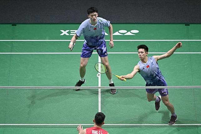 Chen Boyang/Liu Yi &reg; of China in action during the men's doubles round of 16 match against Chiu Hsiang-chieh/Wang Chi-lin of Chinese Taipei at the Malaysia Open badminton tournament in Kuala Lumpur, on Jan. 9, 2025. (Photo by Chong Voon Chung/Xinhua)