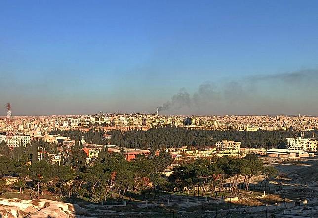 This photo taken with a cell phone shows smoke rising over the city of Aleppo, Syria, on Dec. 1, 2024. (Str/Xinhua)