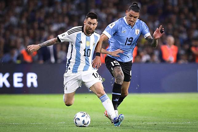 Lionel Messi (L) vies with Uruguay's Darwin Nunez during their 2026 FIFA World Cup qualifier in Buenos Aires, Argentina, on Nov. 16, 2023. (Photo by Martin Sabala/Xinhua)