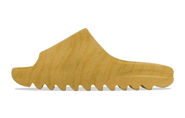 YEEZY SLIDE「OCHRE」的木紋配色十分特殊。圖片來源：<a href=