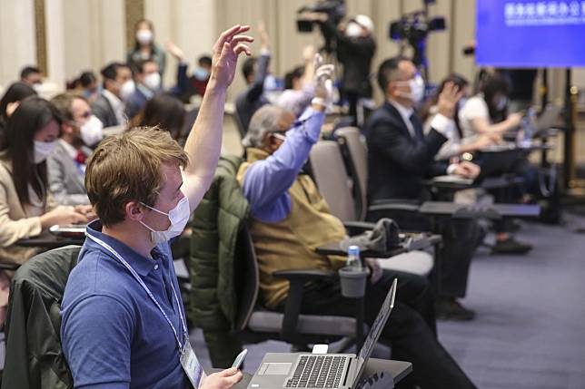 Reporters ask questions at a press conference, held by the State Council Information Office, in Beijing on Tuesday. Photo: Xinhua