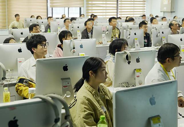 Workers attend a skills training course at a learning center of Foxconn in Zhengzhou, central China's Henan Province, Oct. 12, 2024. (Xinhua/Li Jianan)