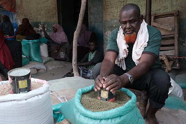 A man sells food products in Balcad town, Shabelle region of Somalia, Dec. 7, 2024. (Photo by Hassan Bashi/Xinhua)