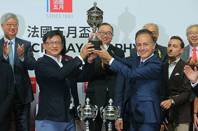 Controversial political figure Junius Ho (second from left) receives a trophy after his horse Hong Kong Bet won a race at Happy Valley in May. Photos: Kenneth Chan