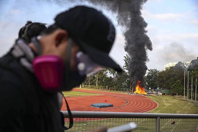 A fire rages on a sports field at the campus of Chinese University. Photo: Winson Wong