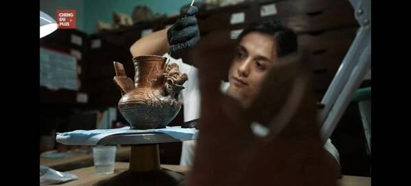 Claudia Meichong-Pastidas, a fourth-generation Chinese-Mexican, works on an artifact unearthed from the Maya region (SCREENSHOT)