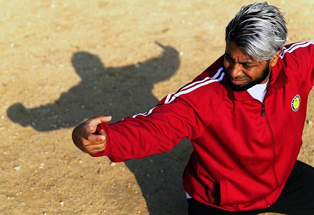 Mohammad Ullah practices drunken fist at Shaolin Epo Martial Arts School in Dengfeng, central China's Henan Province, Oct. 29, 2024. (Xinhua/Li Jianan)