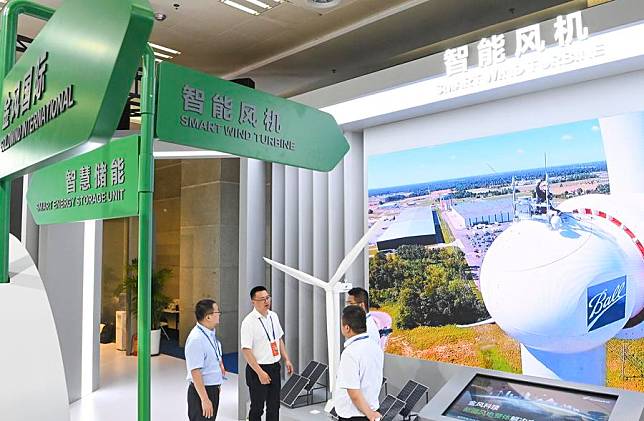 Exhibitors learn about a smart wind turbine at the 8th China-Eurasia Expo in Urumqi, northwest China's Xinjiang Uygur Autonomous Region, June 27, 2024. (Xinhua/Wang Fei)