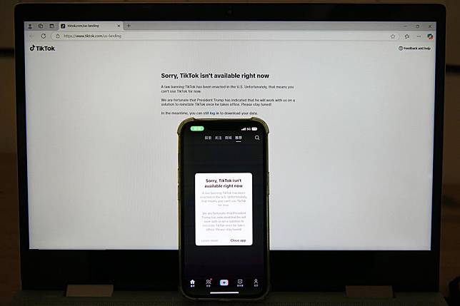 This photo taken in Arlington, the United States on Jan. 19, 2025 shows screens of a mobile phone and a laptop displaying the message &ldquo;Sorry, TikTok isn't available right now.&rdquo; (Xinhua/Li Rui)
