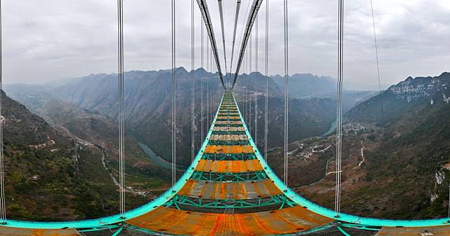 An aerial panoramic drone photo shows a view of the Huajiang grand canyon bridge in southwest China's Guizhou, Jan. 14, 2025. (Xinhua/Yang Wenbin)