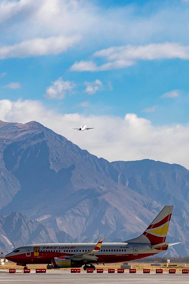 An aircraft takes off from Lhasa Konggar International Airport in Lhasa, capital of southwest China's Xizang Autonomous Region, on Dec. 26, 2023. (Xinhua/Jiang Fan)