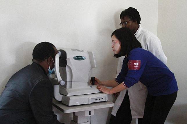 A Chinese doctor examines a patient at a hospital in Harare, Zimbabwe, on Feb. 19, 2025. (Xinhua/Tafara Mugwara)