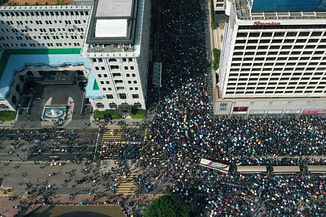 Aerial drone view of buses trapped amongst anti-government protesters in Tsim Sha Tsui, between The Peninsula hotel (left) and Sheraton Kowloon (right) on 20 October 2019. Photo: May Tse