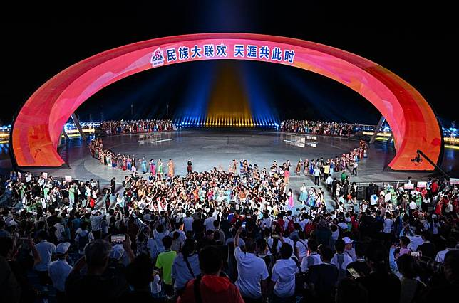 Artists celebrate with the audience at the end of a gala held at the 12th National Traditional Games of Ethnic Minorities of China in Sanya, south China's Hainan Province, Nov. 26, 2024. (Xinhua/Guo Cheng)