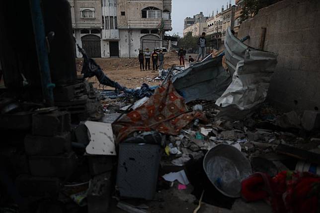 Palestinians are seen at the site of a destroyed tent after an Israeli bombardment in the al-Nuseirat refugee camp in central Gaza Strip, on Jan. 17, 2025. (Photo by Marwan Dawood/Xinhua)