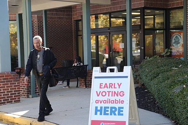 A person leaves an early voting site at Helene S. Mills Multipurpose Facility in Fulton County, Georgia, the United States, on Oct. 22, 2024. (Xinhua/Liu Yanan)