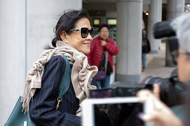 A smiling Amina Mariam Bokhary leaves the Eastern Court in Sai Wan Ho. Photo: Brian Wong