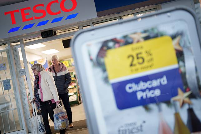 People walk out of a supermarket in Sheffield, Britain, Nov. 7, 2024. (Photo by Jon Super/Xinhua)