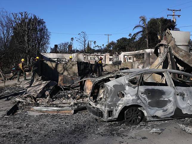 Firefighters check wildfire-damaged structures in Altadena, California, United States, Jan. 15, 2025. (Photo by Qiu Chen/Xinhua)