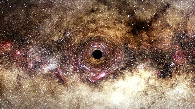 天文學家首藉重力透鏡發現巨大黑洞 質量為太陽300億倍