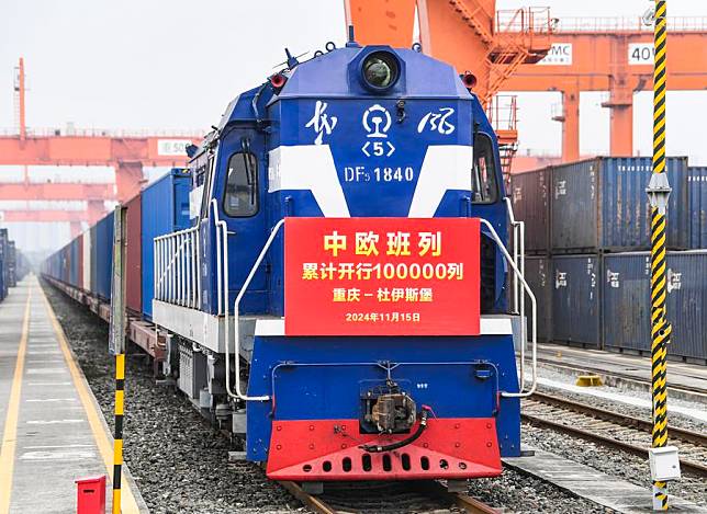 The 100,000th China-Europe freight train, coded X8083, waits for departing at the Tuanjiecun Station in Chongqing, southwest China, Nov. 15, 2024. The 100,000th China-Europe freight train departed from southwest China's Chongqing Municipality on Friday morning, a significant milestone in the development of the service that facilitates economic and trade exchanges between China and Europe. (Xinhua/Wang Quanchao)