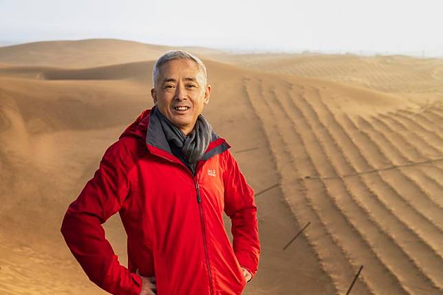 Lu Qi poses for a photo at an experimental center in Dengkou County of Bayannur, north China's Inner Mongolia Autonomous Region, on Oct. 13, 2024. (Photo by Justin Jin/UNEP/Handout via Xinhua)