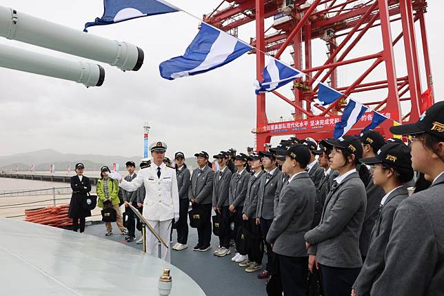 Students and faculties visit a military vessel during an open day activity in Ningbo of east China's Zhejiang Province, April 23, 2023. (Photo by Meng Yinqi/Xinhua)