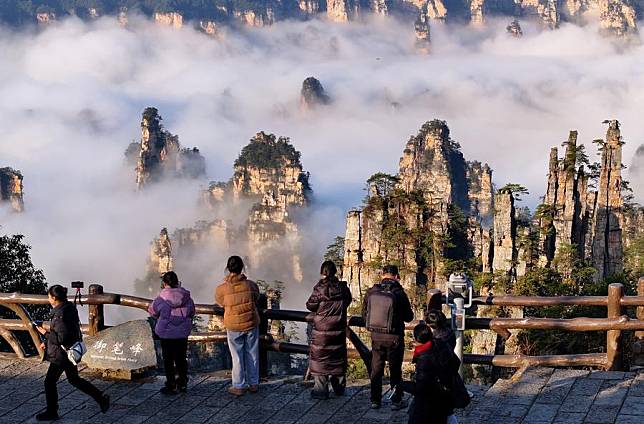 Tourists visit the Zhangjiajie National Forest Park in Zhangjiajie, central China's Hunan Province, on Jan. 3, 2024. (Photo by Wu Yongbing/Xinhua)