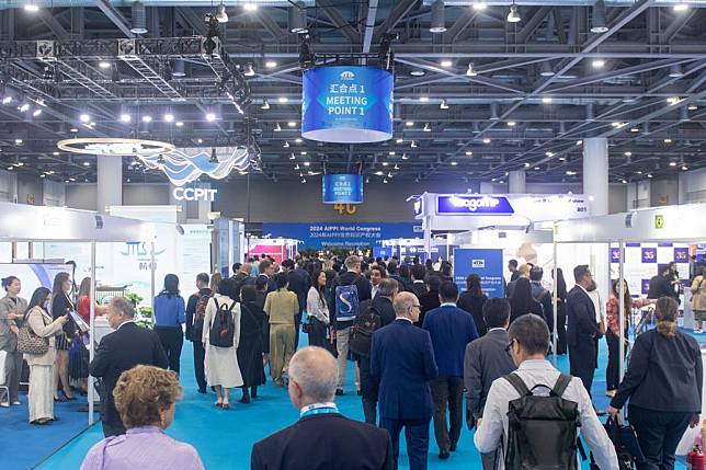 Participants visit an exhibition at the venue of the 2024 International Association for the Protection of Intellectual Property (AIPPI) World Congress in Hangzhou, east China's Zhejiang Province, Oct. 19, 2024. (Xinhua/Jiang Han)