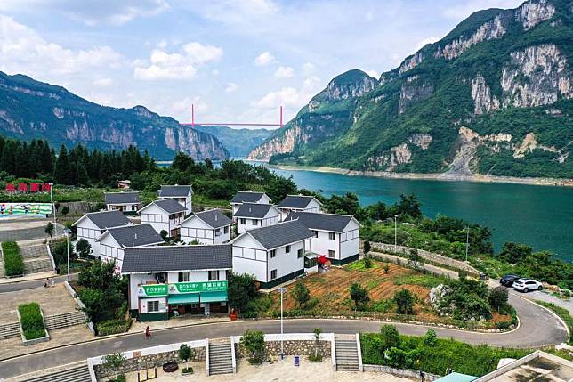 An aerial drone photo taken on July 24, 2021 shows a view of a relocation site for poverty alleviation at Huawu Village in Xinren Miao Township, Qianxi City, southwest China's Guizhou Province. (Xinhua/Yang Wenbin)