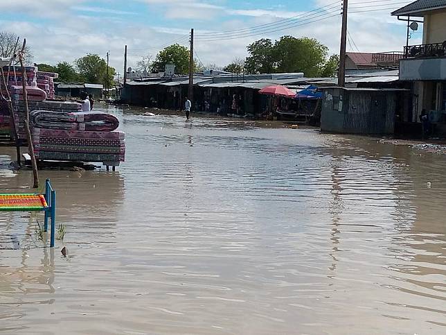 People are seen at the flooded Marol Market in Bor, Jonglei State, South Sudan, Oct. 15, 2021. (Photo by Daniel Majak/Xinhua)