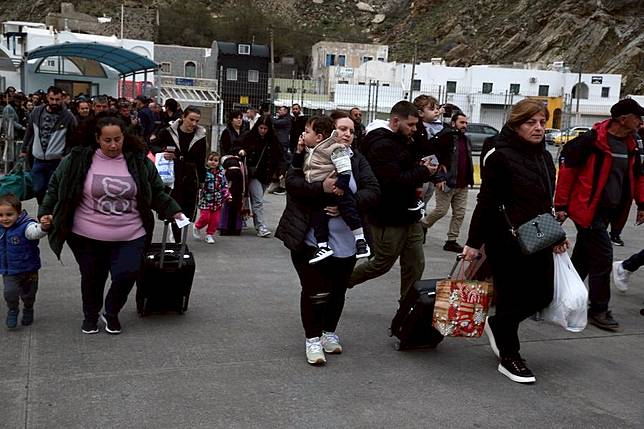 People walk to board a ferry to leave Santorini after earthquakes shook the island, in Santorini, Greece, on Feb. 4, 2025. (Xinhua/Marios Lolos)
