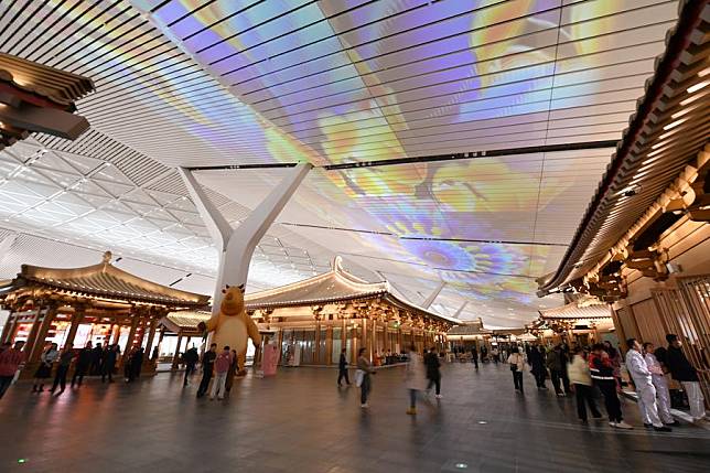 People walk at the departure hall of Terminal 5 of Xianyang International Airport in Xi'an, capital of northwest China's Shaanxi Province, Feb. 20, 2025. (Xinhua/Shao Rui)